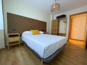 dormitorio-apartamentos-escarrilla-suites-3000-escarrilla-pirineo-aragones.jpg